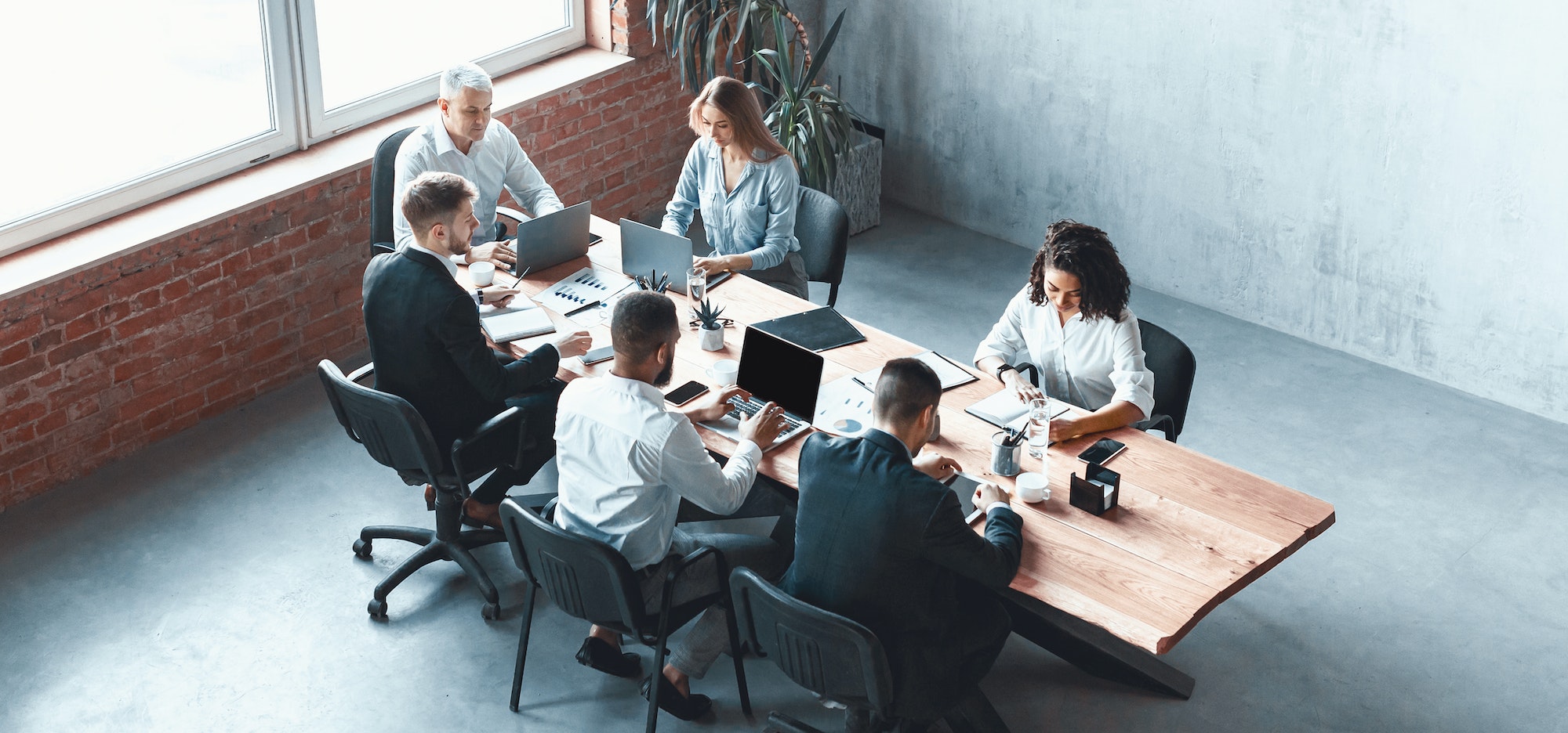 Multiethnic Business Team Working Together Sitting In Modern Office, Panorama