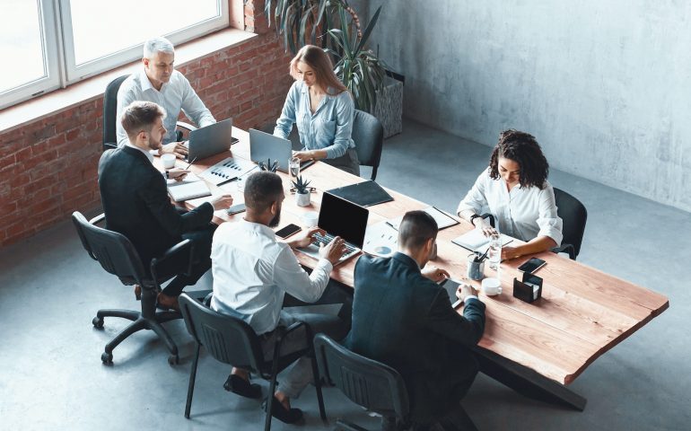 Multiethnic Business Team Working Together Sitting In Modern Office, Panorama